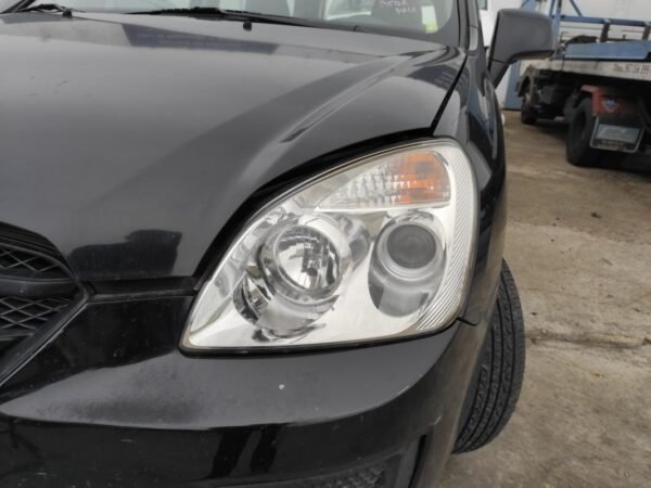 Faro izquierdo Kia Carens III 2.0 CRDi (115 cv)